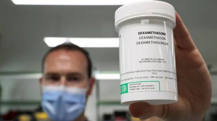 A pharmacist displays a box of Dexamethasone at the Erasme Hospital amid the coronavirus disease (COVID-19) outbreak, in Brussels