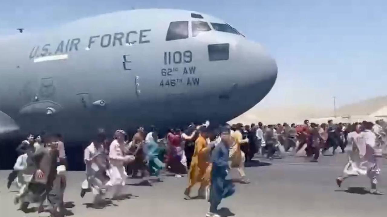 Video shows desperate Afghans who clung to plane falling off from sky ...