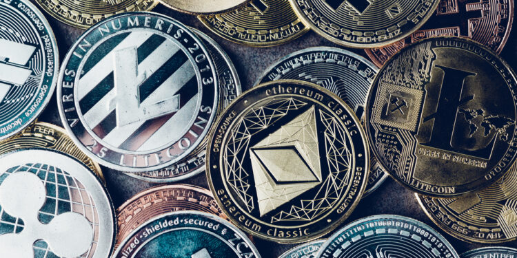 Crypto currency background with various of shiny silver and golden physical cryptocurrencies symbol coins, Bitcoin, Ethereum, Litecoin, zcash, ripple.